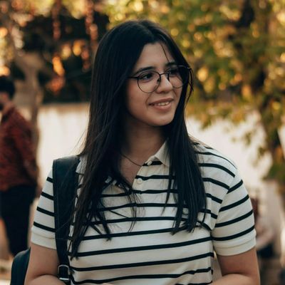 Portrait of a smiling young woman with glasses